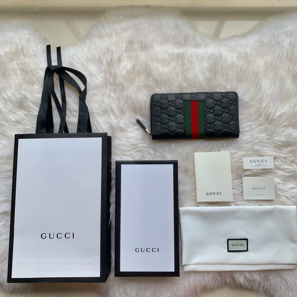G*u*i leather zip around wallet